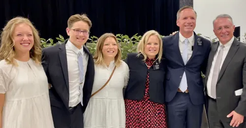 posed photo of a family with Elder Soares