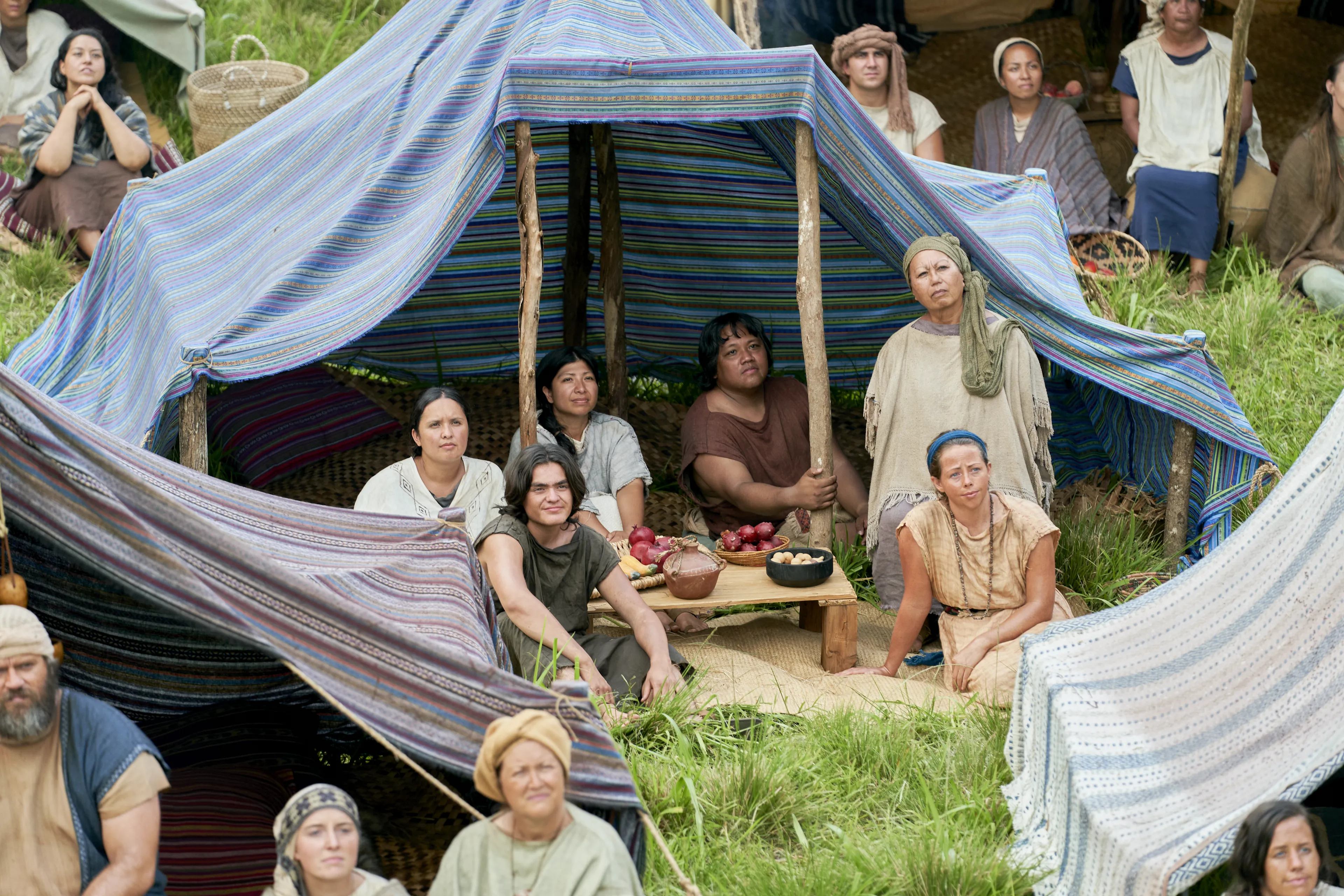 Men and women gather to listen to King Benjamin in the Land of Zarahemla.