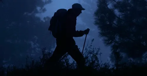 hiker in the dark