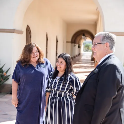 sister missionary with mission president and his wife
