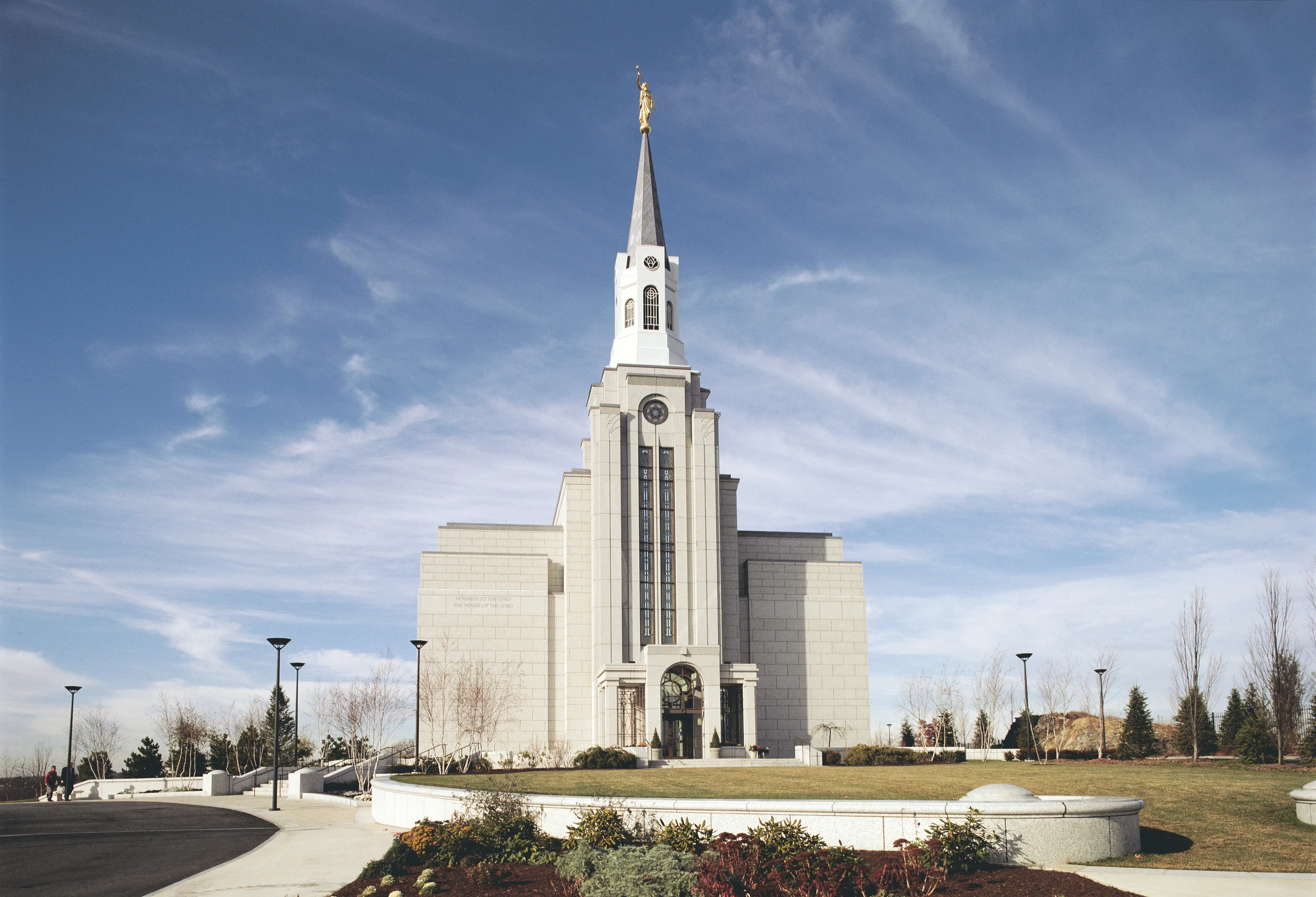 The exterior of the Boston Massachusetts Temple and bordering sidewalks and flower beds.