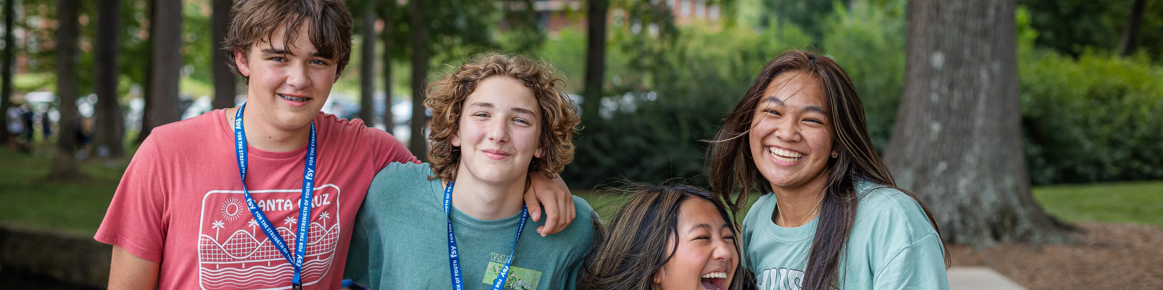 Two young men and two young women stand together for a group photo. Picture taken during the FSY event in South Carolina, July 2023.