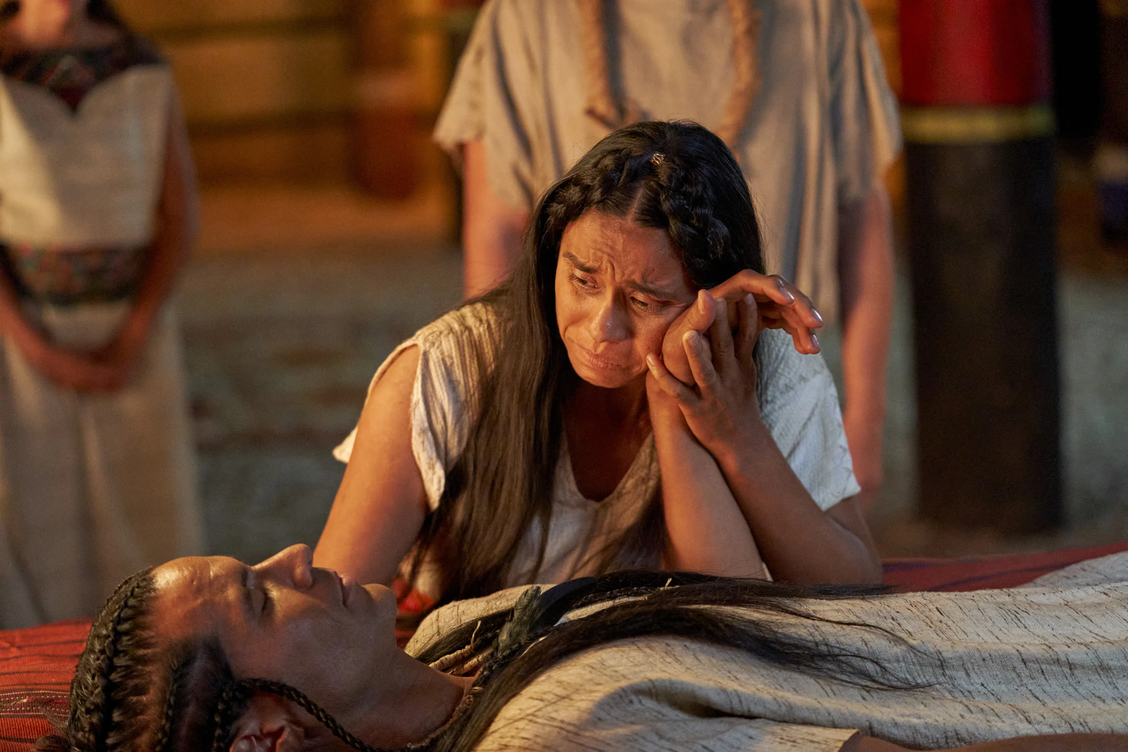 The wife of King Lamoni grieves over Lamoni as he lays as if he were dead in the land of Ishmael.