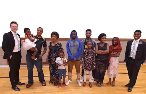 missionaries with group of people at church