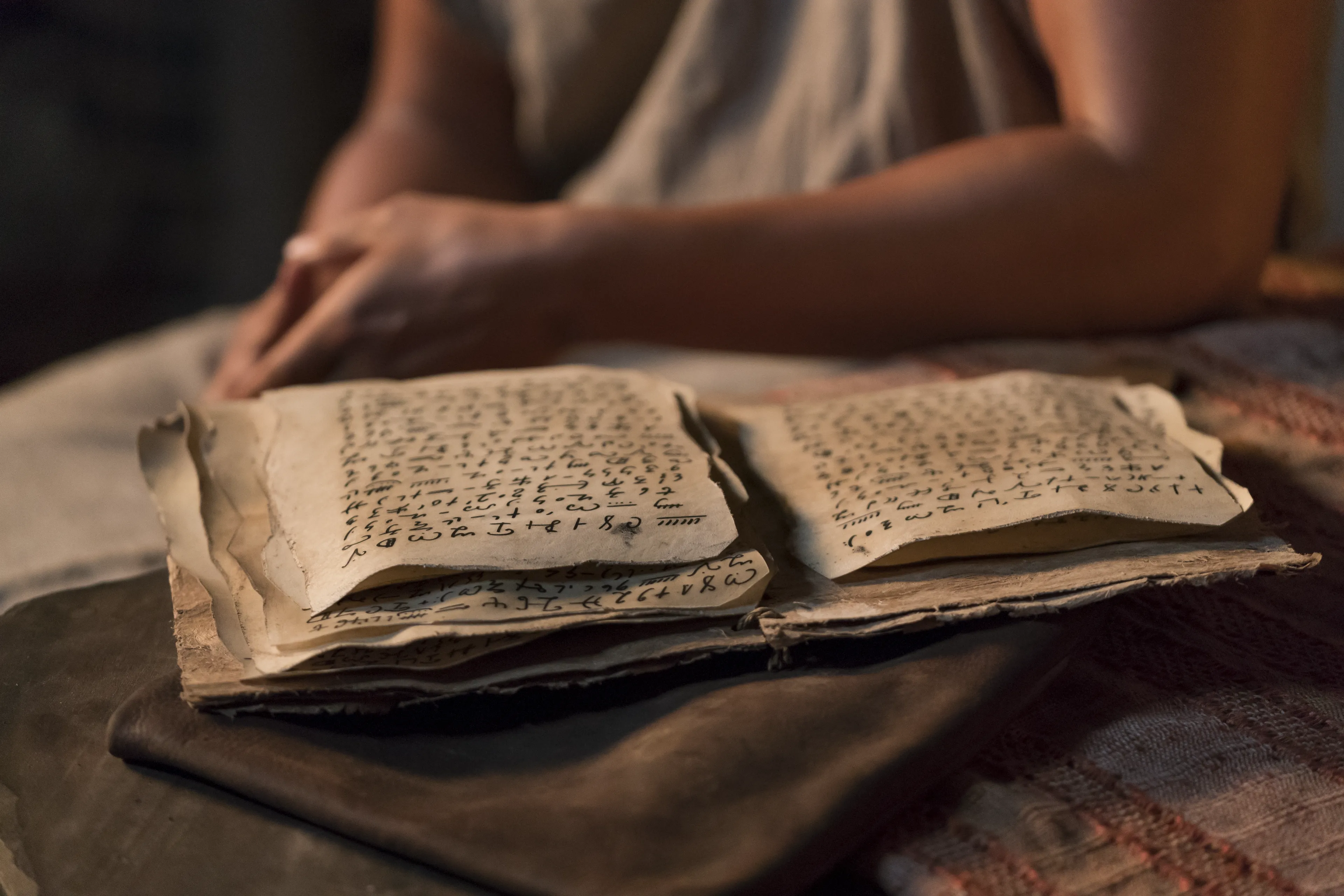 Papers with teachings of Abinadi rest on a table.