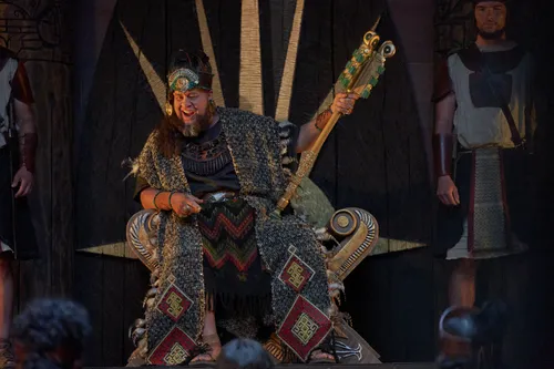 King Noah watches as Abinadi is questioned.