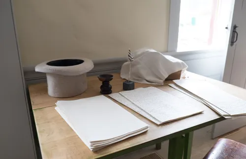 desk with hat, papers, and other items