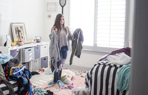 young woman tidying up