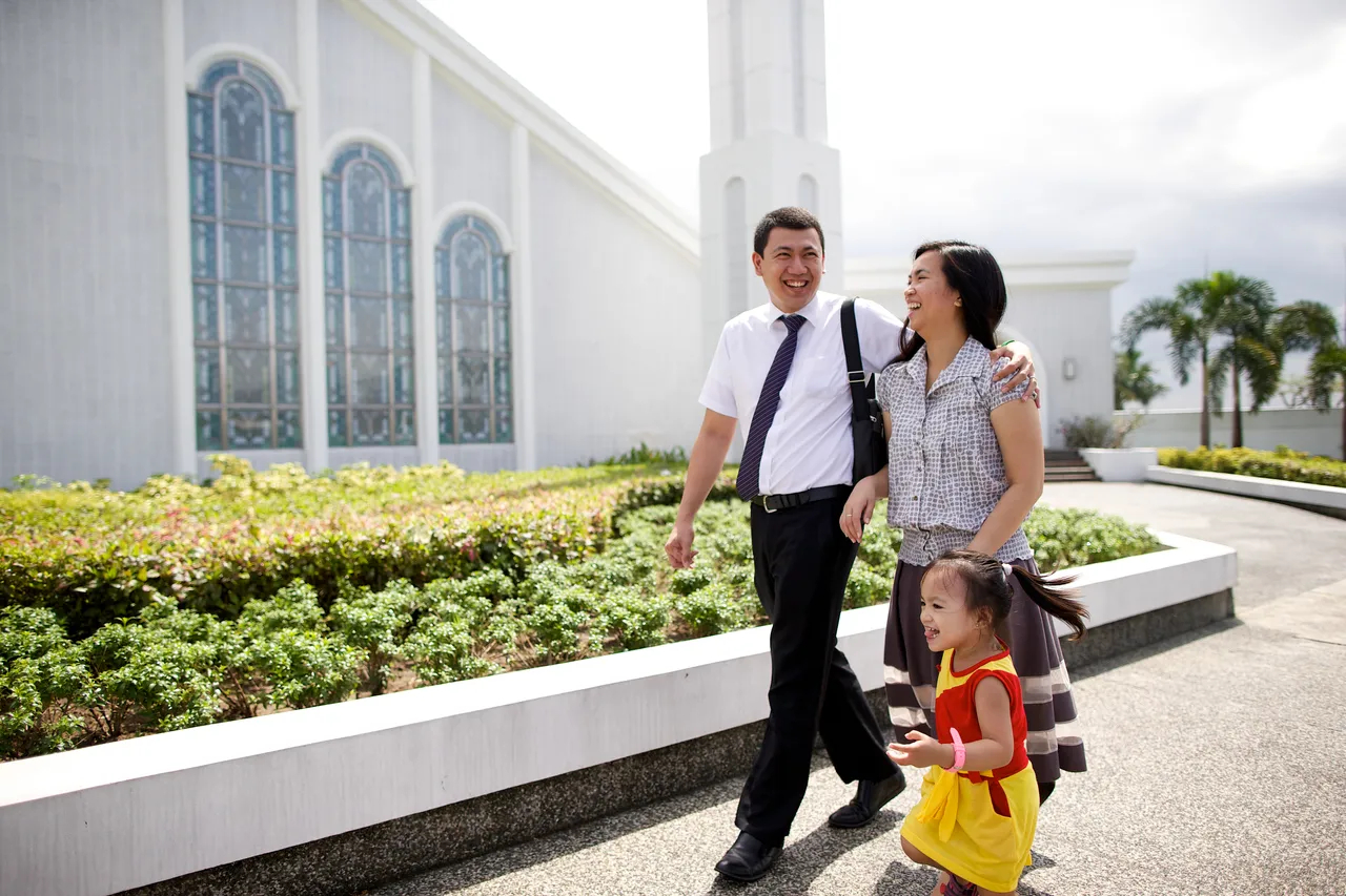 A young family walk to church together