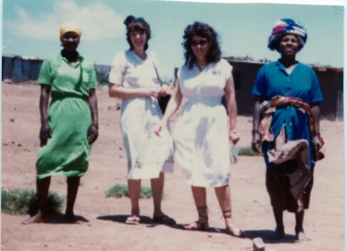 sister missionaries with two women