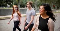 Young adults walking together and talking in Australia