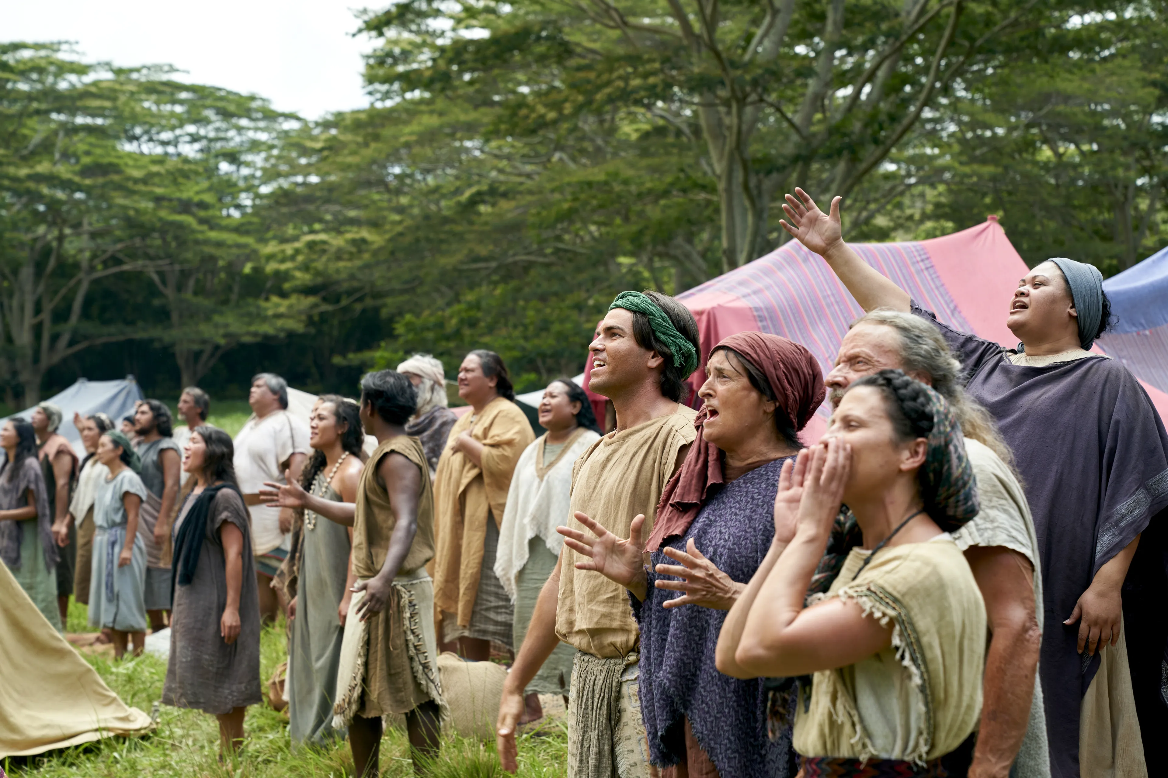 Men and women gather to listen to King Benjamin in the Land of Zarahemla.