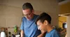 father and son cooking