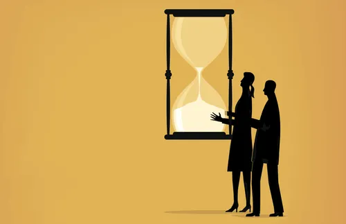 couple holding hourglass