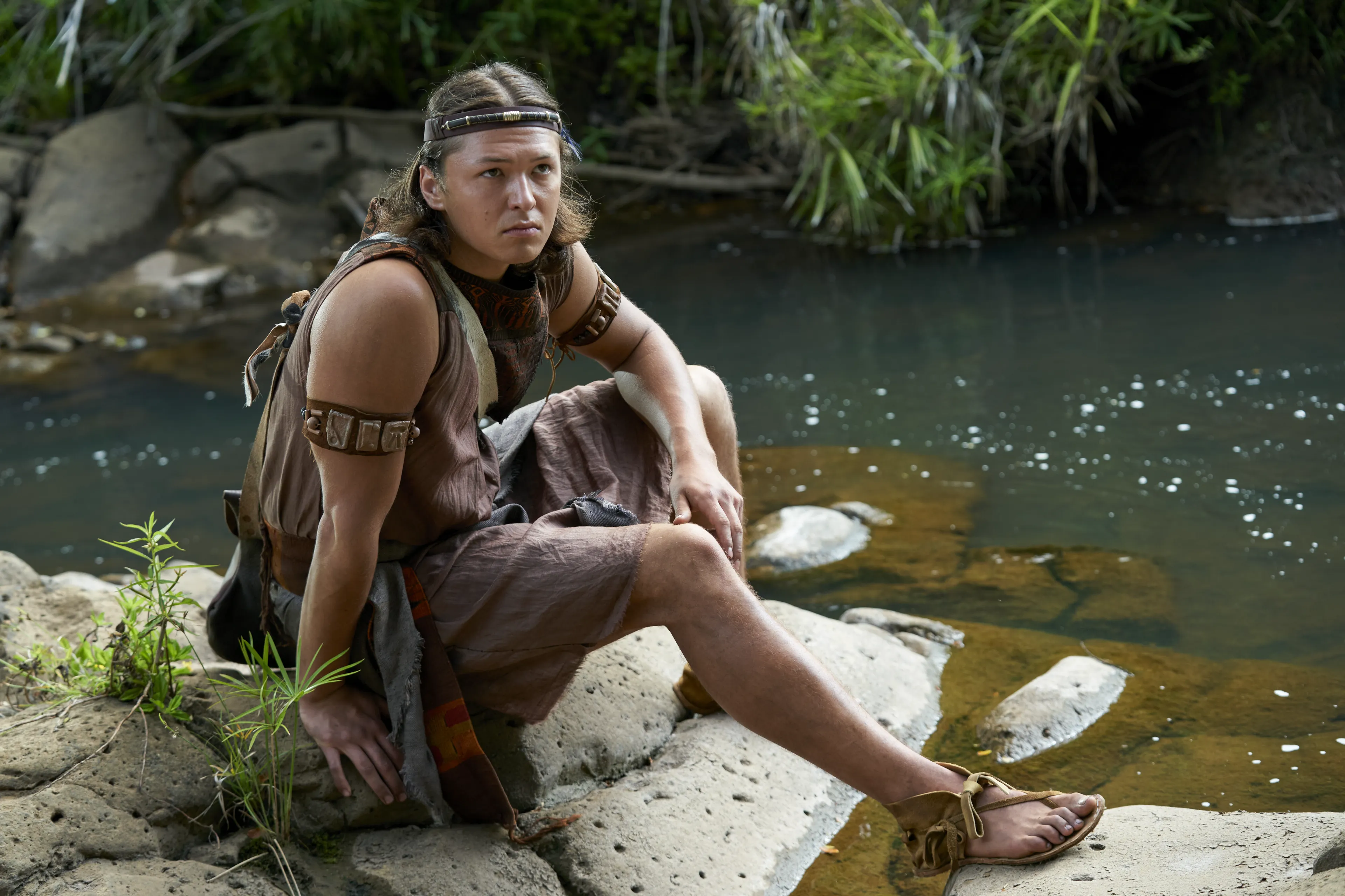 Aaron, son of Mosiah, sits near a pond.