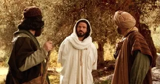 the resurrected Lord walks with two disciples