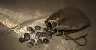 coins spilling out of a purse