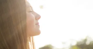 sun shining on young adult