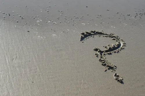 question mark in the sand