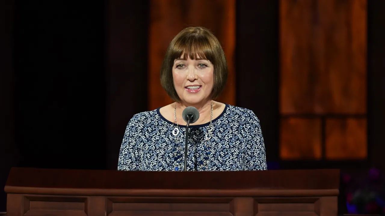 Sister Franco standing to give conference address