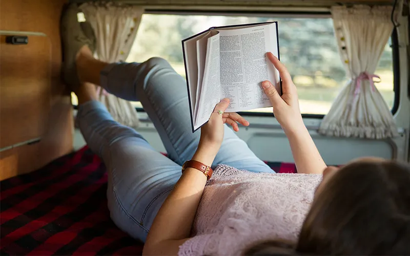 A woman learns about overcoming hard times through studying the Book of Mormon in a camper