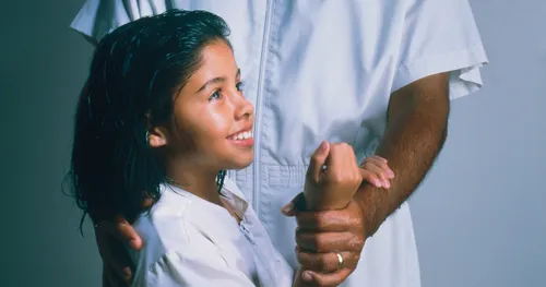 young girl getting baptized