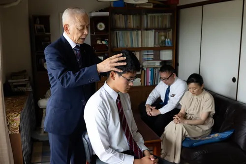 young man receiving his patriarchal blessing