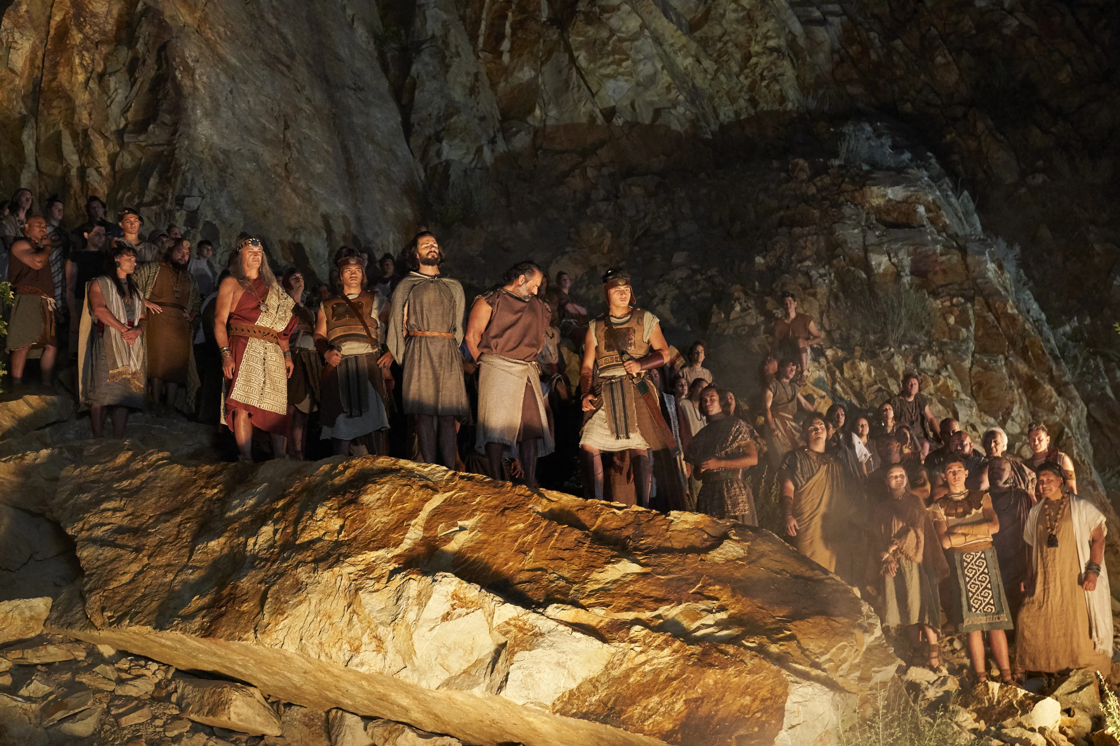 Alma the Younger and Amulek look away as the women and children of Ammonihah who believed their words are cast into the fire.