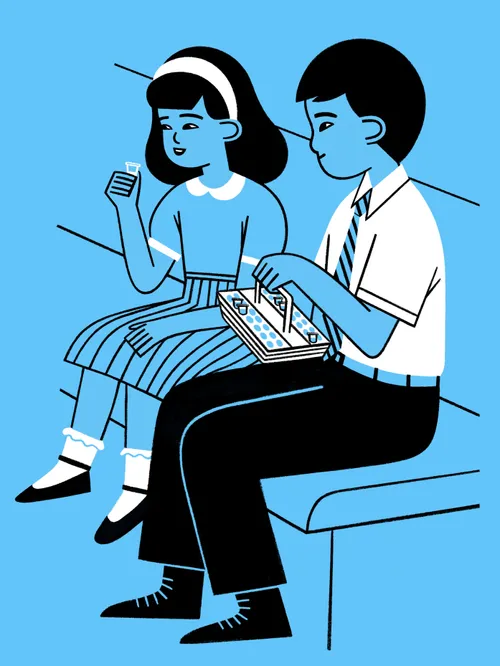a boy and a girl taking the sacrament