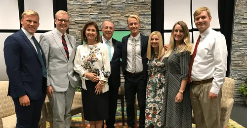 posed photo of people with Elder and Sister Soares