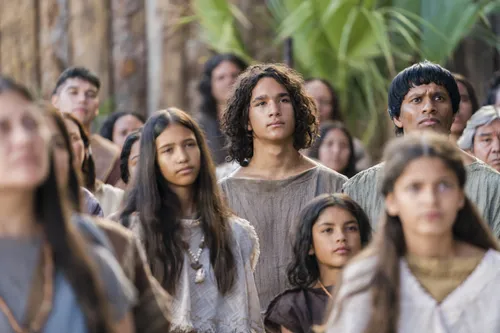 A young man listens as Alma the Younger preaches to the people of Gideon.