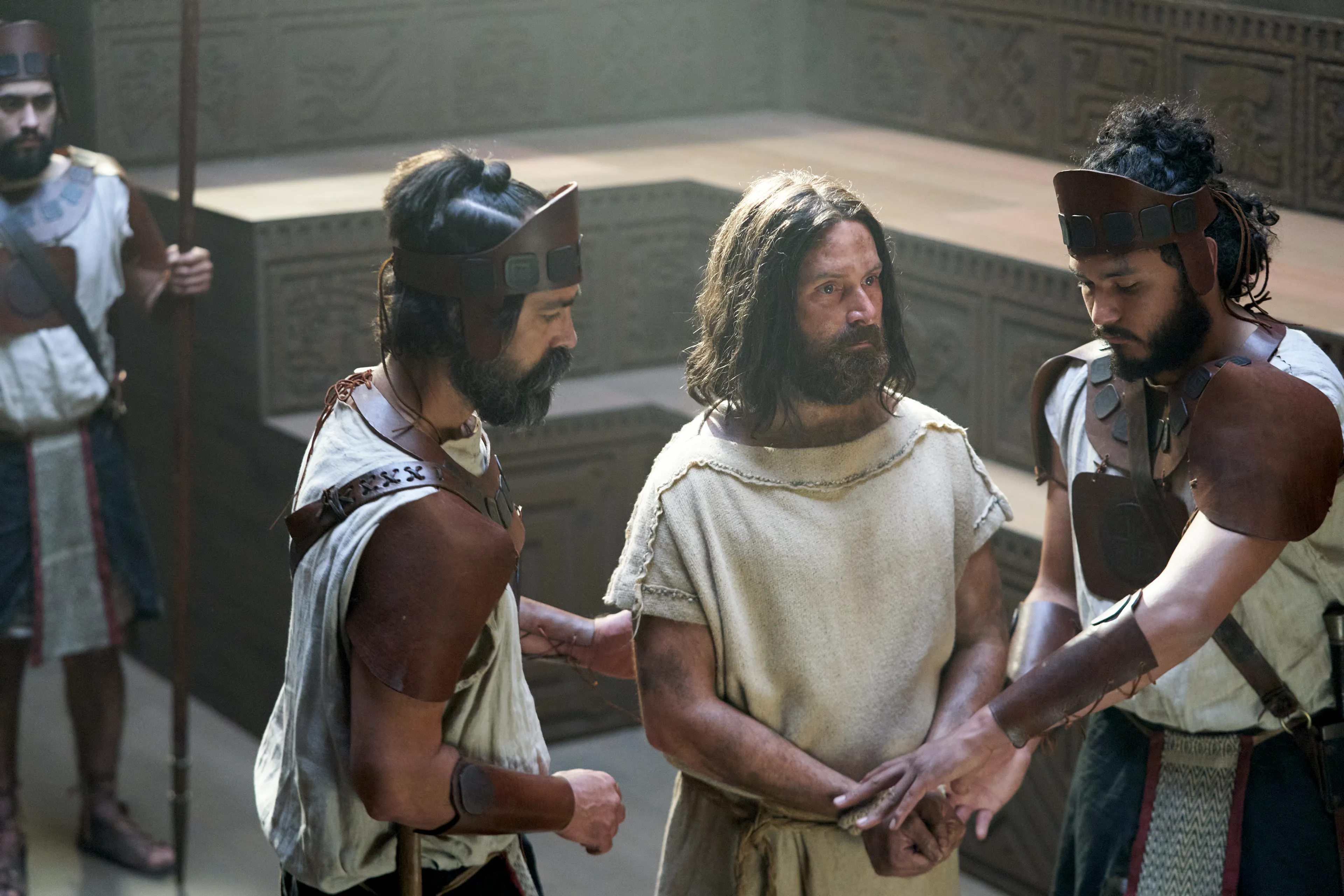 Abinadi is brought in to the court of King Noah by guards.