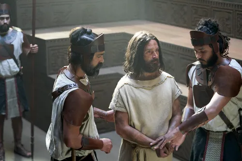 Abinadi is brought in to the court of King Noah by guards.