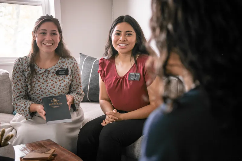 A congregation sit together in a chapel pew learning about the gospel of Jesus Christ