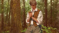 image of Joseph Smith praying in the Sacred Grove