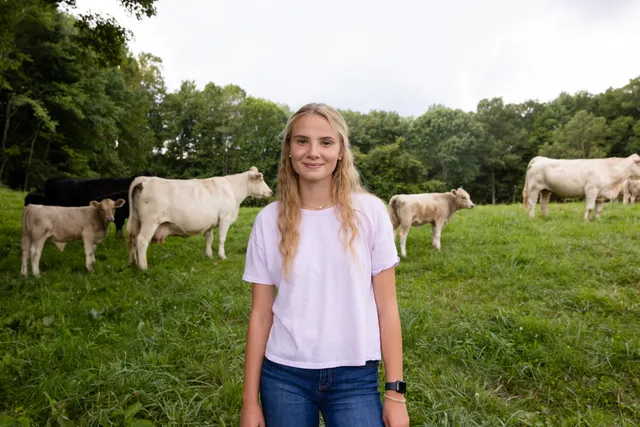 Young Woman Outside with Cattle