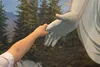child feeling hand of Christus statue