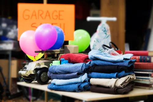 Items on a table at a garage sale.