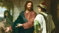Jesus Christ depicted in red and black robes. Christ is talking to a rich young man. Christ has His arms extended as He gestures toward a poorly dressed man and woman. The painting depicts the event wherein Christ was approached by a young man who inquired of Christ what he should do to gain eternal life. Christ instructed him to obey the commandments and to give his wealth to the poor and follow Him. The young man was unable to part with his wealth and went away sorrowfully. (Matthew 19:16-26) (Mark 10:17-27) (Luke 18:18-27)