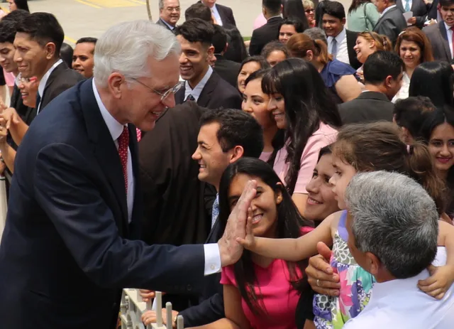 Elder D. Todd Christofferson greets a young Latter-day Saint after the rededication of the Asunción Paraguay Temple on Sunday, November 3, 2019.