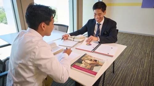 Missionaries studying Preach my Gospel