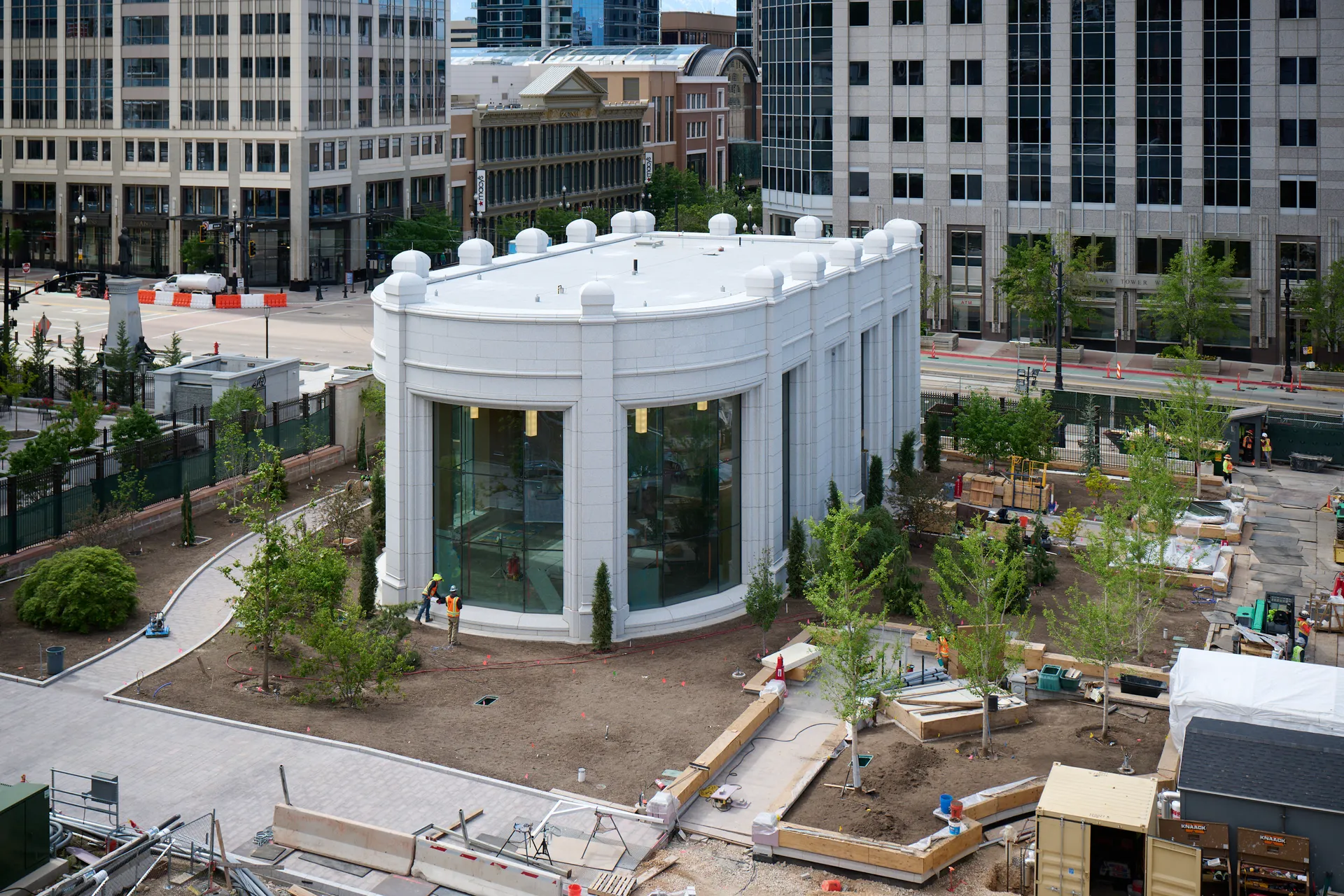 A view of Temple Square during renovations in May 2025. The image features an overview of the South Pavilion's east building surrounded by landscaping.