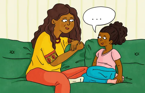 Woman and girl talking on couch
