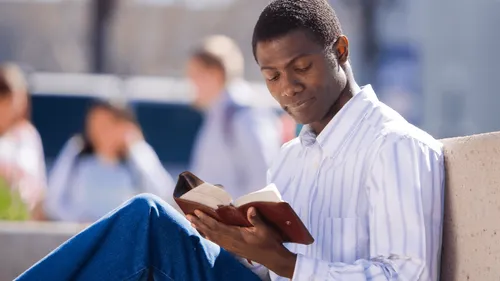 man studying the scriptures