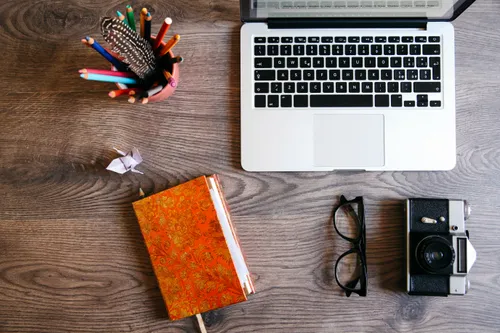 desk with laptop and general conference issue