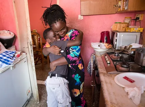 mother hugging her son