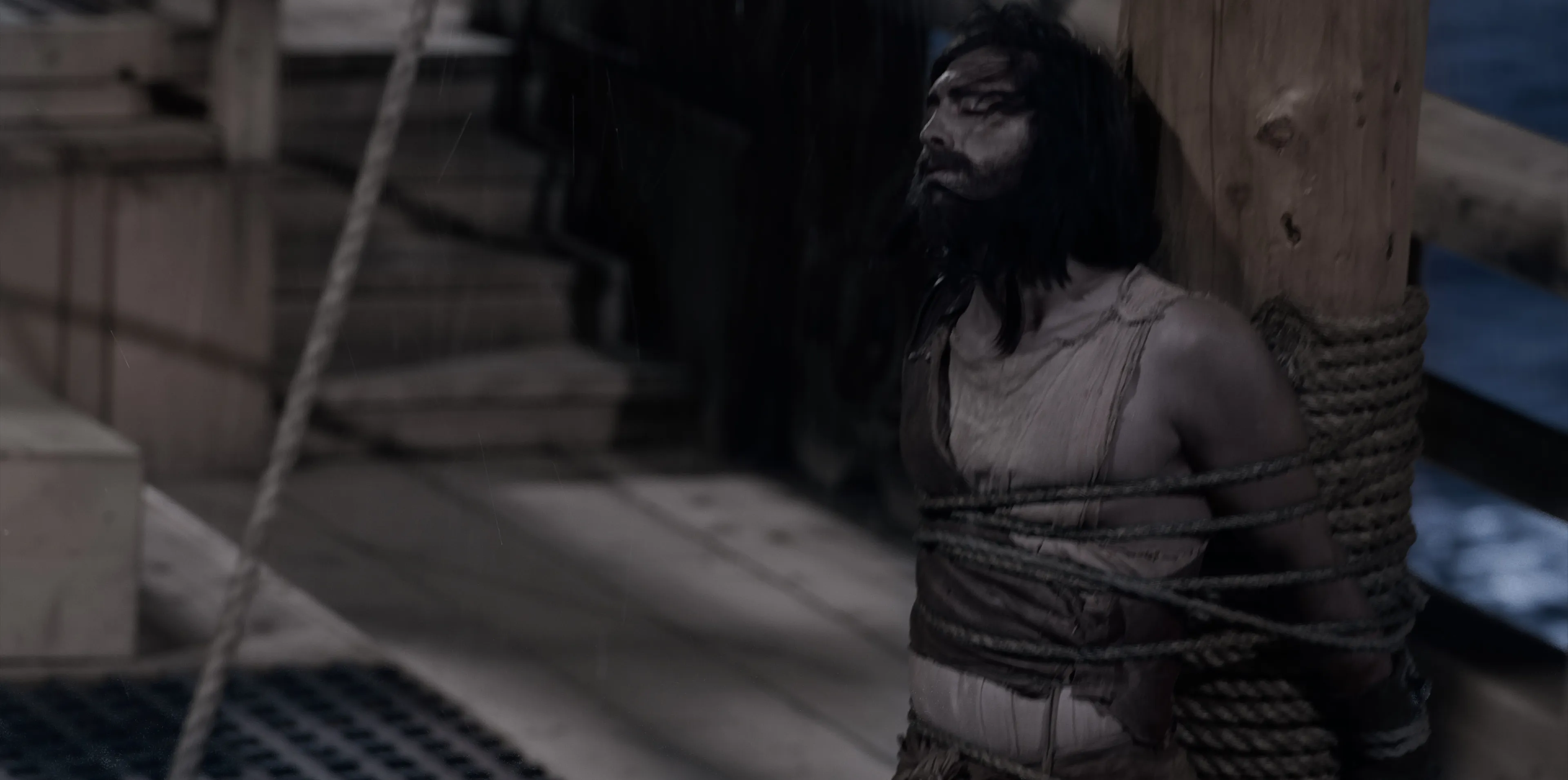 Nephi is tied to the ship's mast and a storm rises in the background.