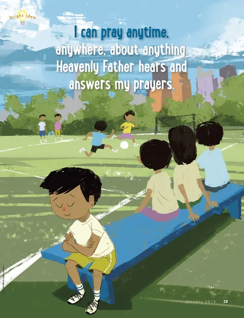 a boy praying at soccer game