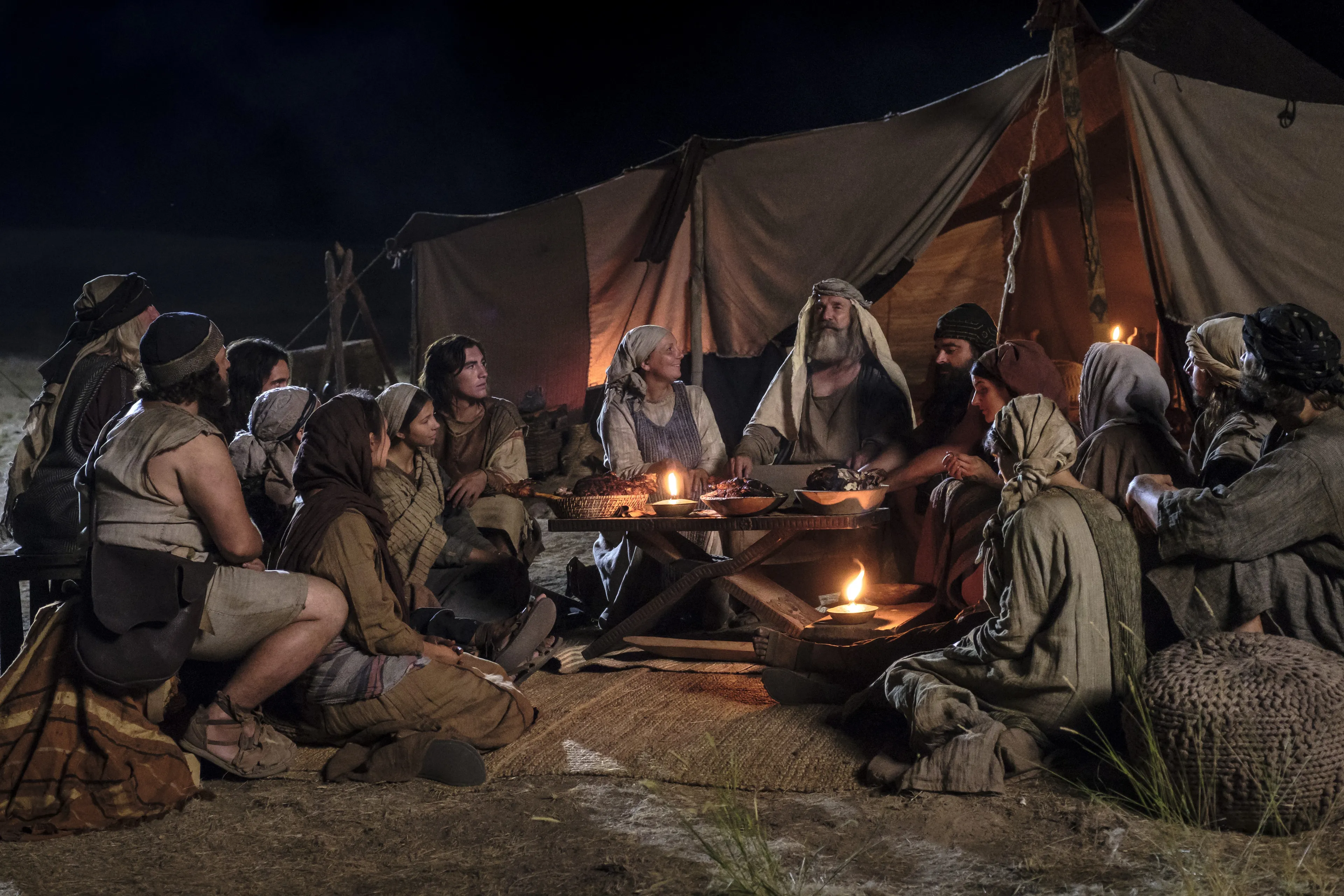 Lehi and Ishmael's families eat in the wilderness after Nephi obtains food.