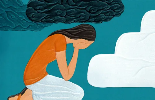 a young woman cries while kneeling under a dark cloud